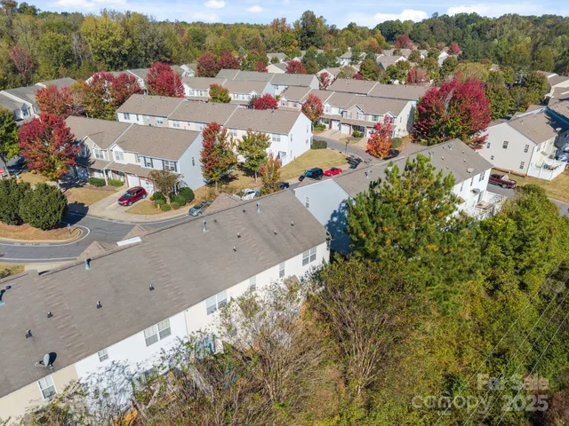 a view of a town with mountains in the background