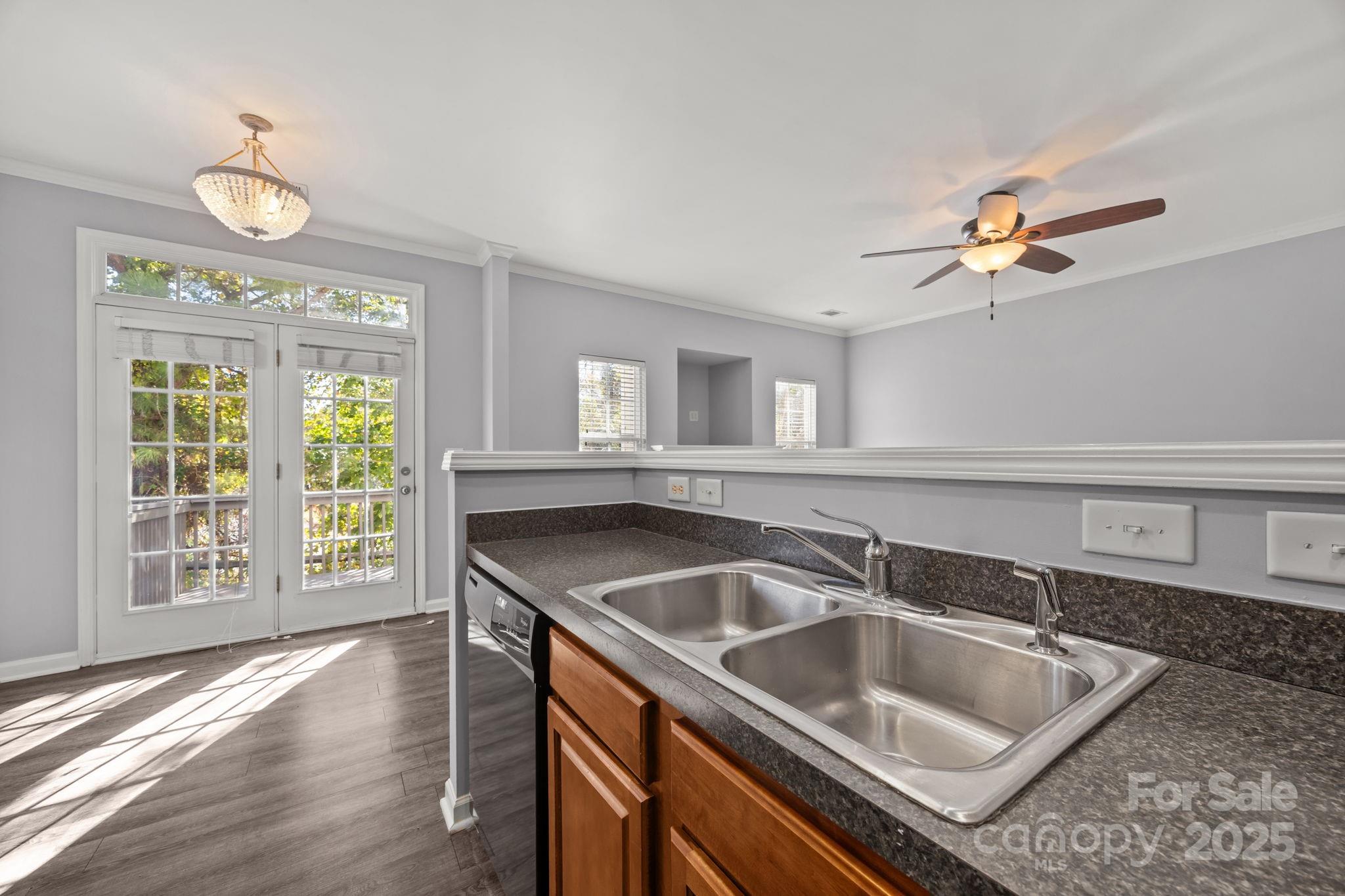 218 Tail Race Lane Fort Mill, SC 29715 - Photo 7 of 42 a kitchen that has a sink and a wooden floor