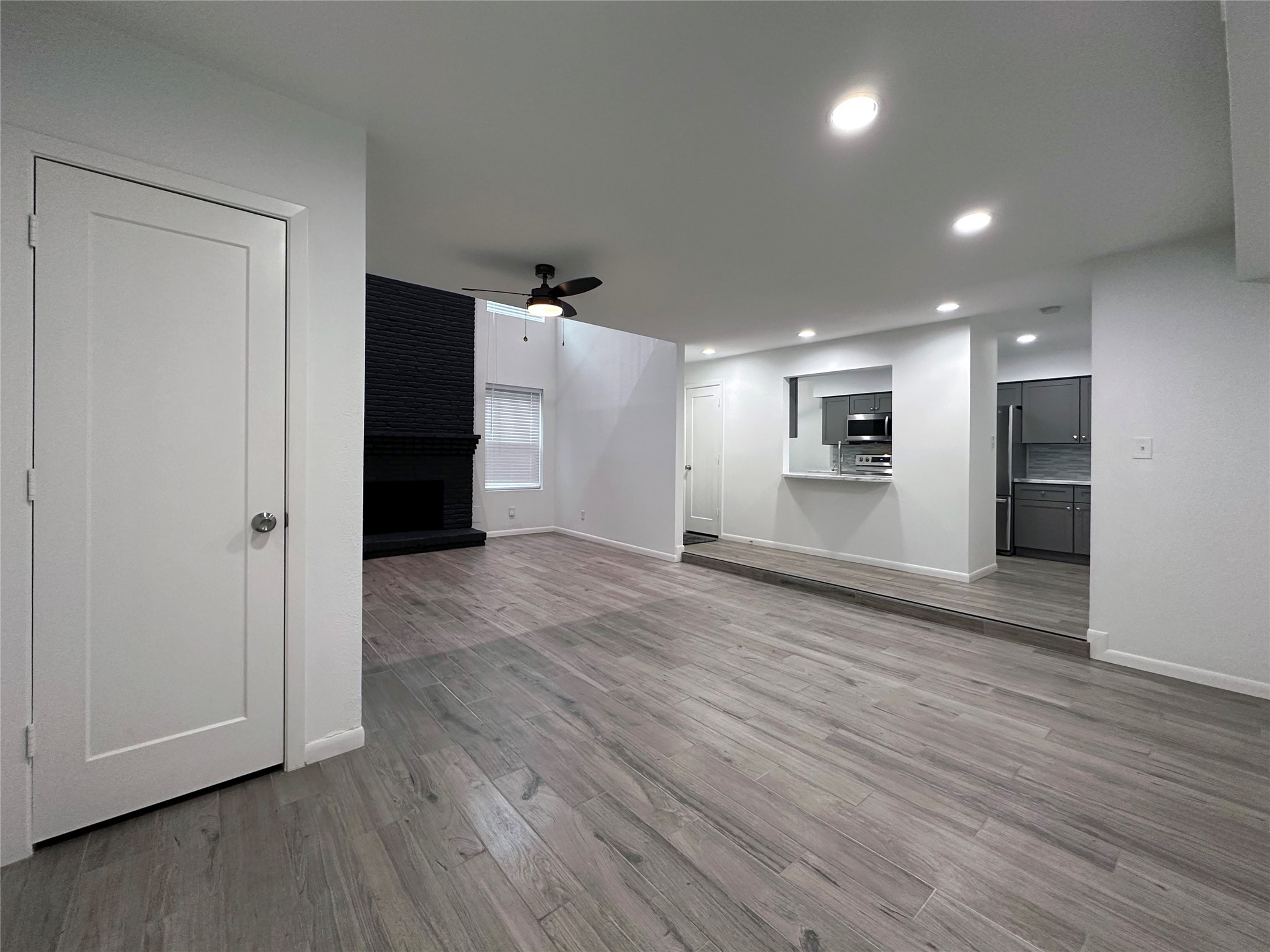5528 Beverly Hill Street, Unit 3 Houston, TX 77056 - Photo 13 of 50 a view of empty room with wooden floor