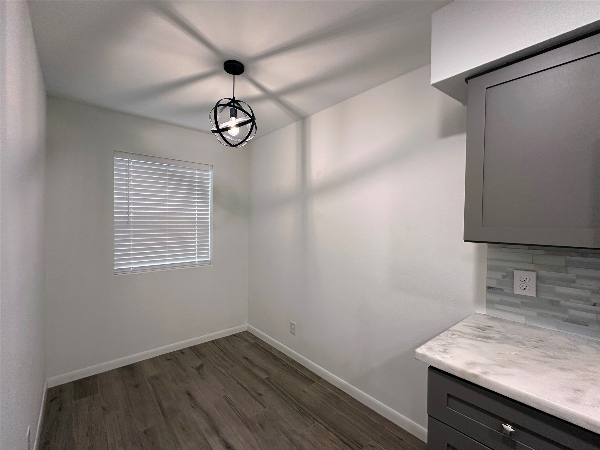 5528 Beverly Hill Street, Unit 3 Houston, TX 77056 - Photo 19 of 50 a view of a storage and utility room with wooden floor