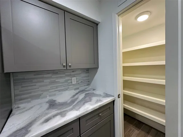 a view of storage and utility room with washer and dryer