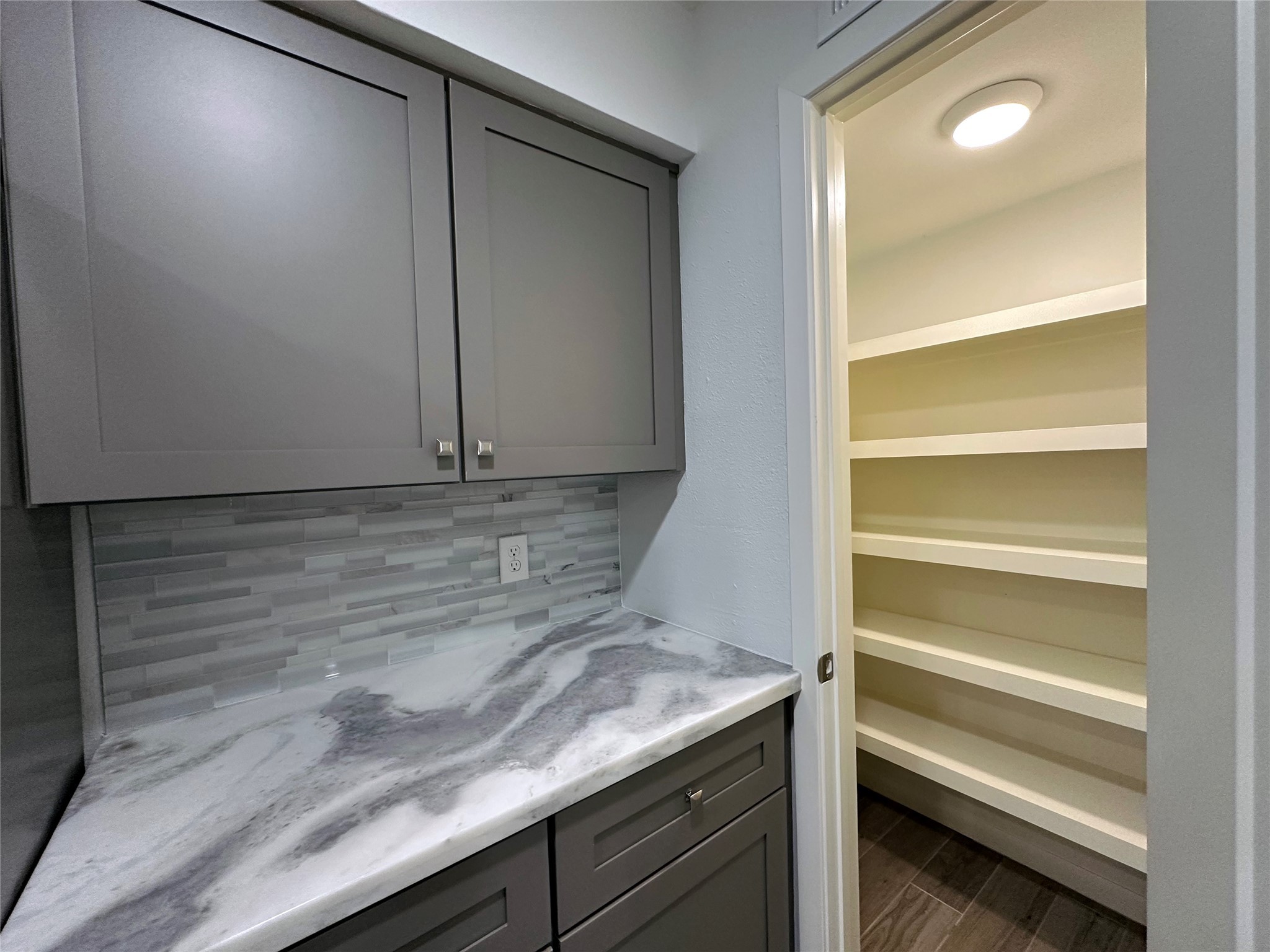 5528 Beverly Hill Street, Unit 3 Houston, TX 77056 - Photo 21 of 50 a view of storage and utility room with washer and dryer