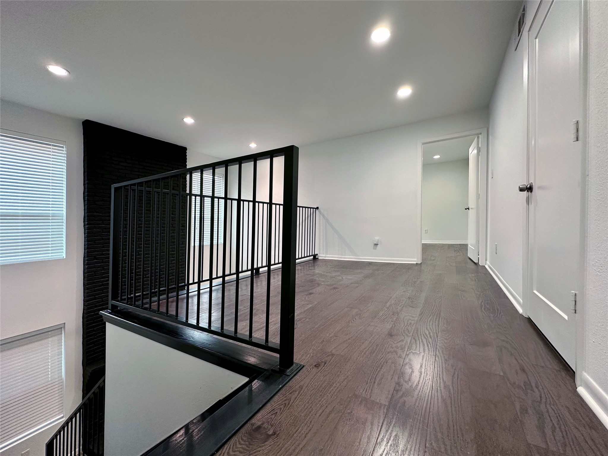 5528 Beverly Hill Street, Unit 3 Houston, TX 77056 - Photo 26 of 50 a view of a hallway with wooden floor