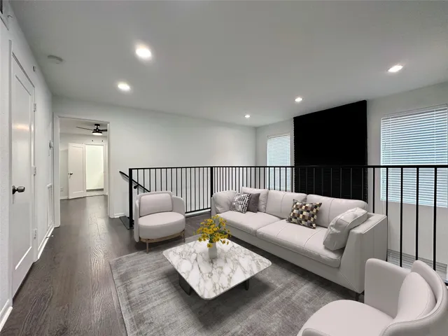 a living room with furniture and a couch