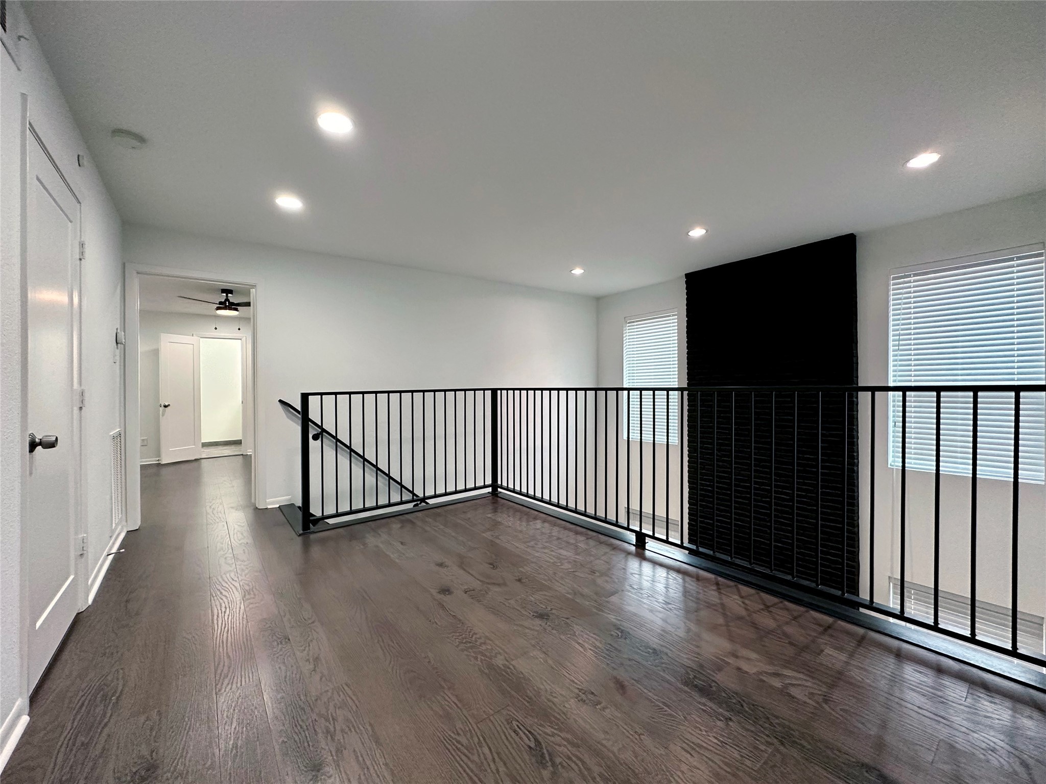 5528 Beverly Hill Street, Unit 3 Houston, TX 77056 - Photo 28 of 50 a view of a hallway with wooden floor