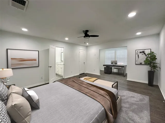 a bedroom with a bed and a couch