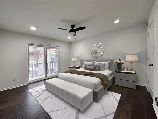 a spacious bedroom with a large bed and a chandelier