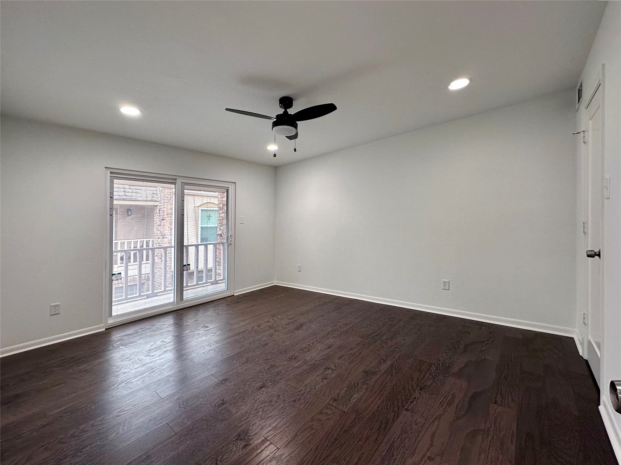 5528 Beverly Hill Street, Unit 3 Houston, TX 77056 - Photo 42 of 50 a view of an empty room with wooden floor and a window