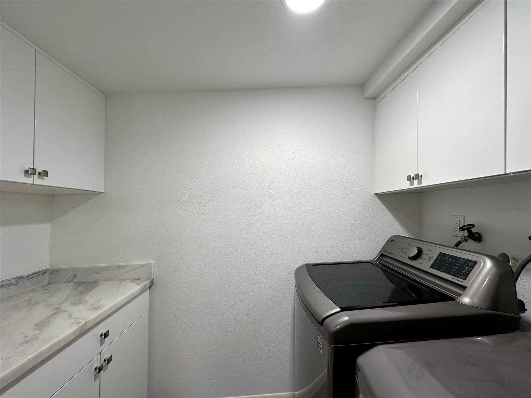 5528 Beverly Hill Street, Unit 3 Houston, TX 77056 - Photo 47 of 50 a utility room with dryer and washer