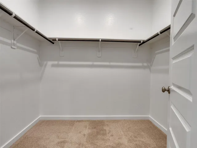 a view of an empty walk in closet