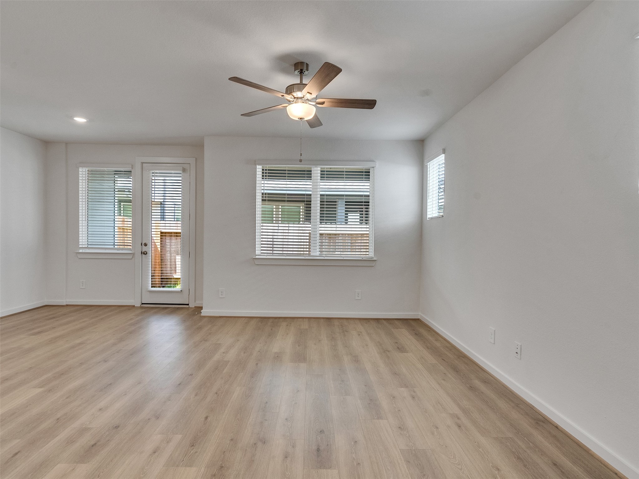 4113 Fig Grv Street Houston, TX 77080 - Photo 4 of 21 a view of an empty room with wooden floor and a window