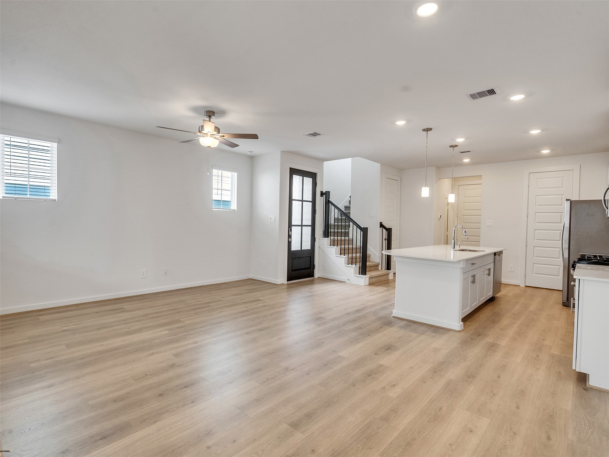 4113 Fig Grv Street Houston, TX 77080 - Photo 6 of 21 a view of a living room a kitchen and a chandelier