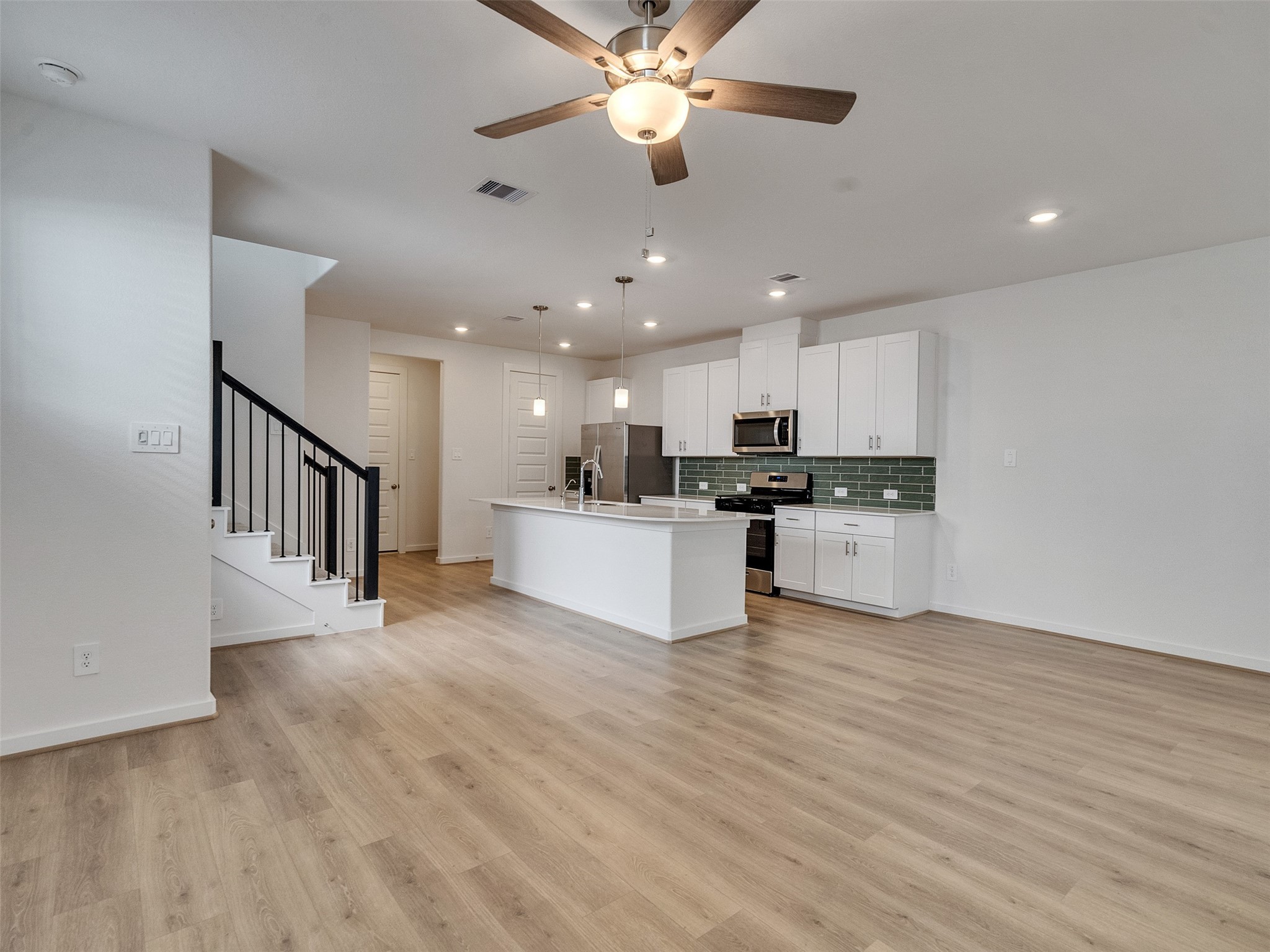4113 Fig Grv Street Houston, TX 77080 - Photo 7 of 21 a view of kitchen with kitchen island wooden floor center island and appliances