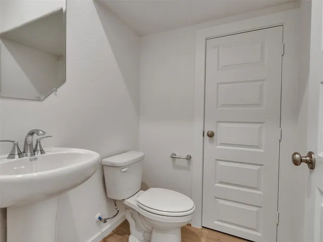 a view of kitchen with kitchen island wooden floor center island and appliances