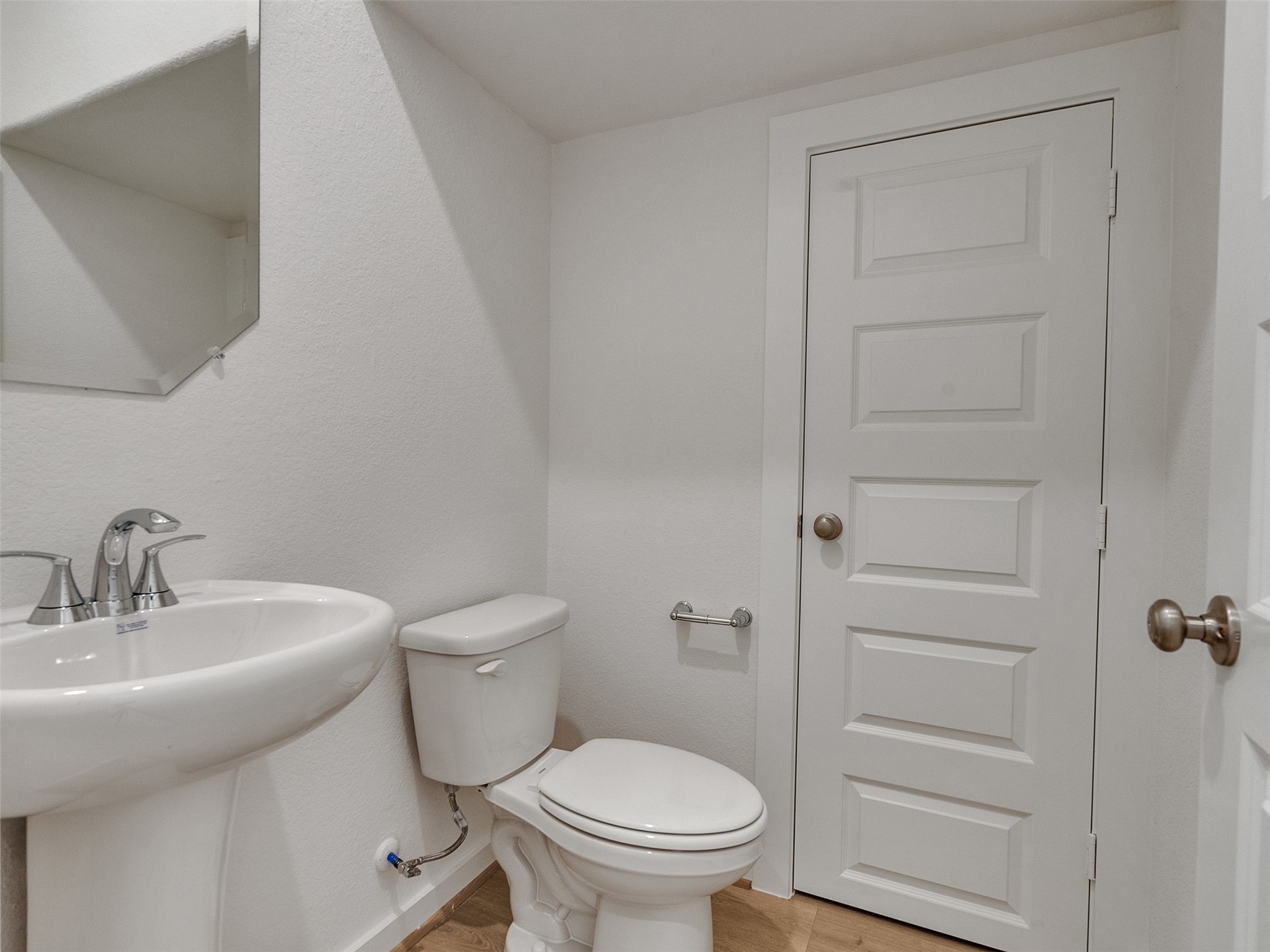 4113 Fig Grv Street Houston, TX 77080 - Photo 8 of 21 a bathroom with a toilet a sink and mirror