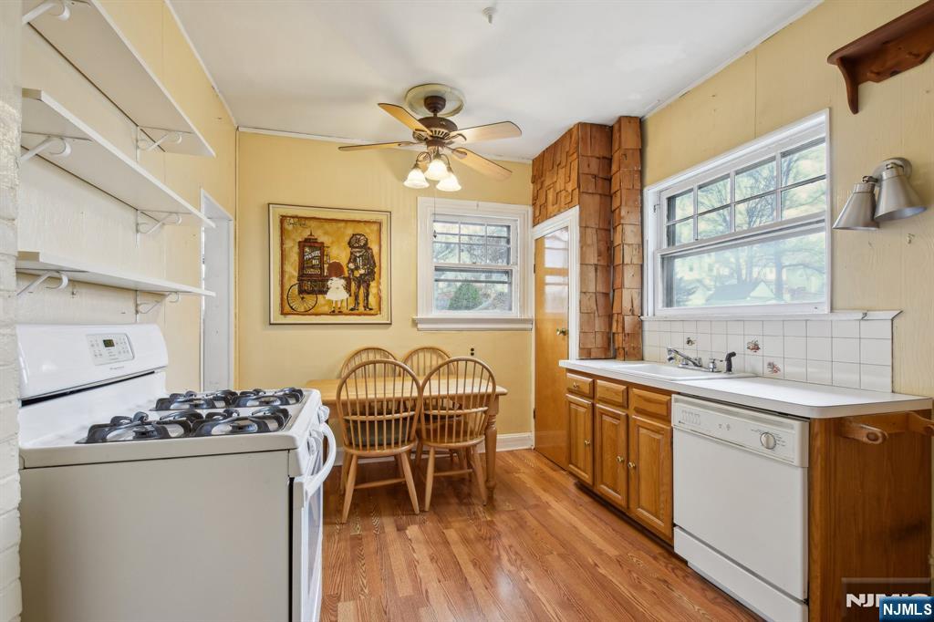 60 Berkeley Avenue Bloomfield, NJ 07003 - Photo 5 of 17 a view of a kitchen filled with furniture and windows