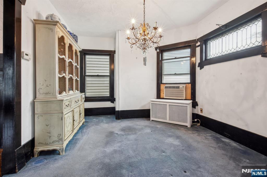 60 Berkeley Avenue Bloomfield, NJ 07003 - Photo 6 of 17 a view of an empty room with window and furniture