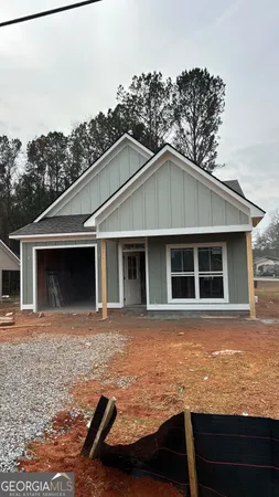 a front view of a house with yard