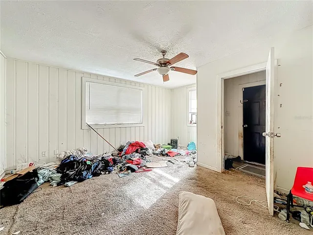a bed room with a bed and a chandelier