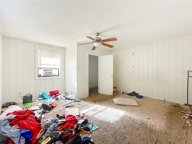 a bed room with a bed and a chandelier