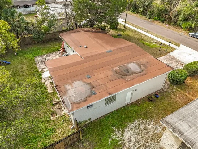 a aerial view of a house with a yard