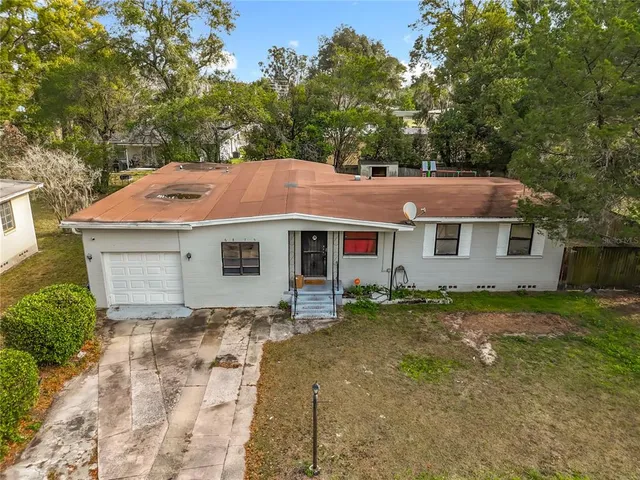 a house with trees in the background