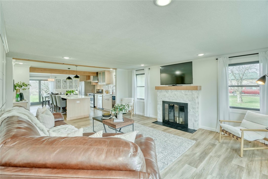 1056 Lake Road Ontario, NY 14519 - Photo 6 of 49 FAMILY ROOM with a wide, open layout, NEW LVP & TI