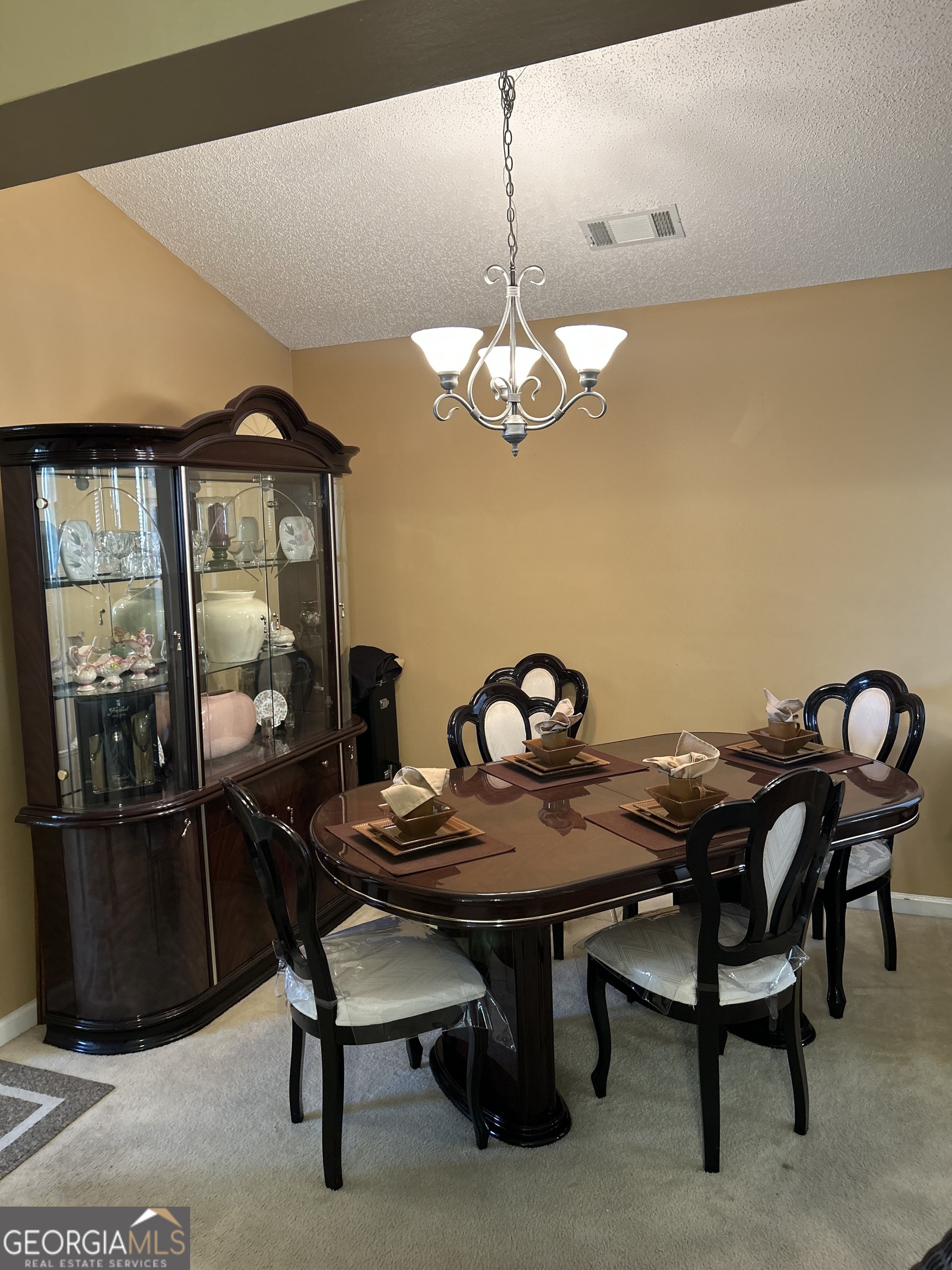 4889 Ozment Ridge Court Lithonia, GA 30038 - Photo 8 of 16 a view of a dining room with furniture