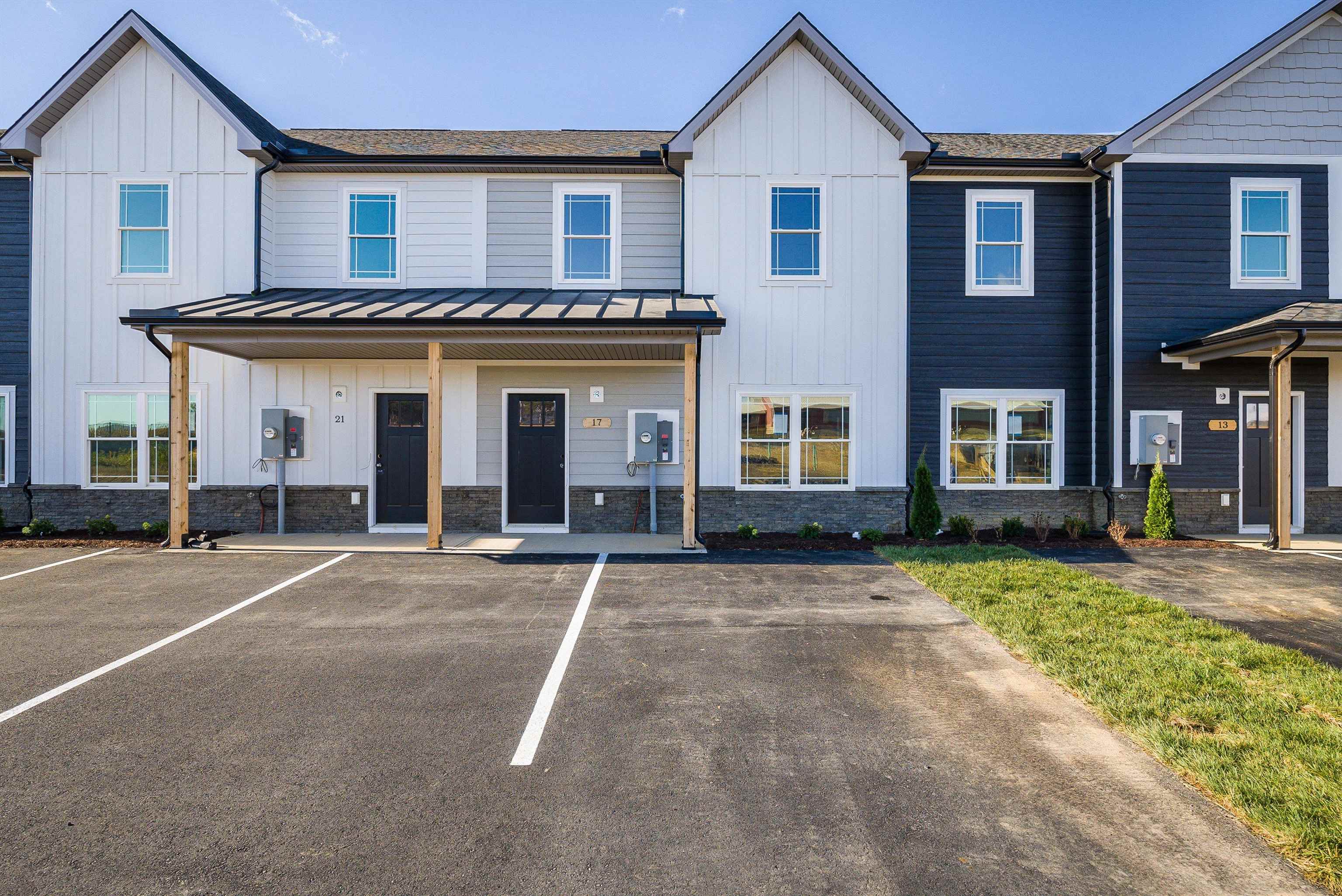 White/Gray Exterior with LP Smart Siding and 2 parking spaces.