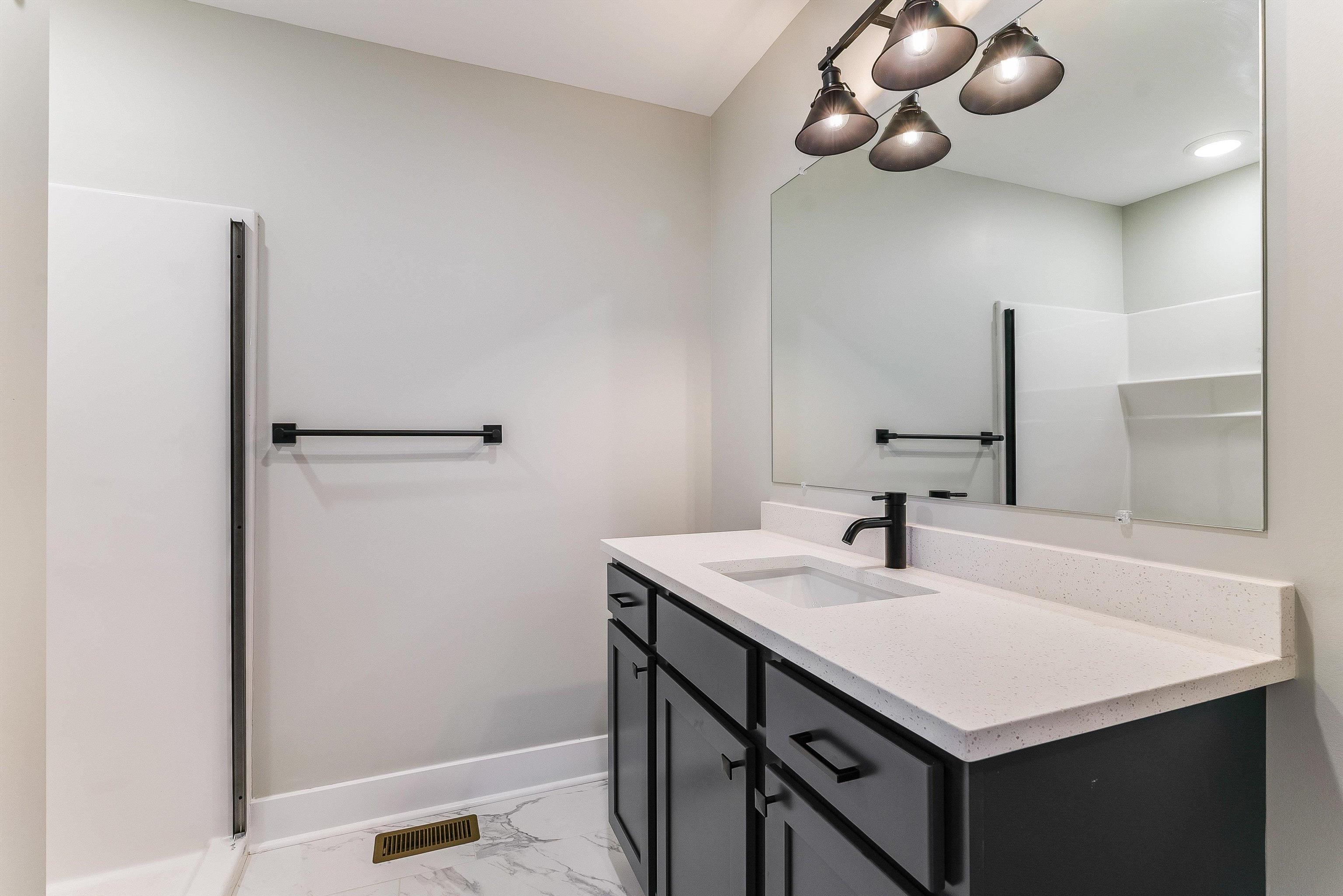 17 Barnyard Circle Bridgewater, VA 22812 - Photo 27 of 74 a bathroom with a sink and a mirror