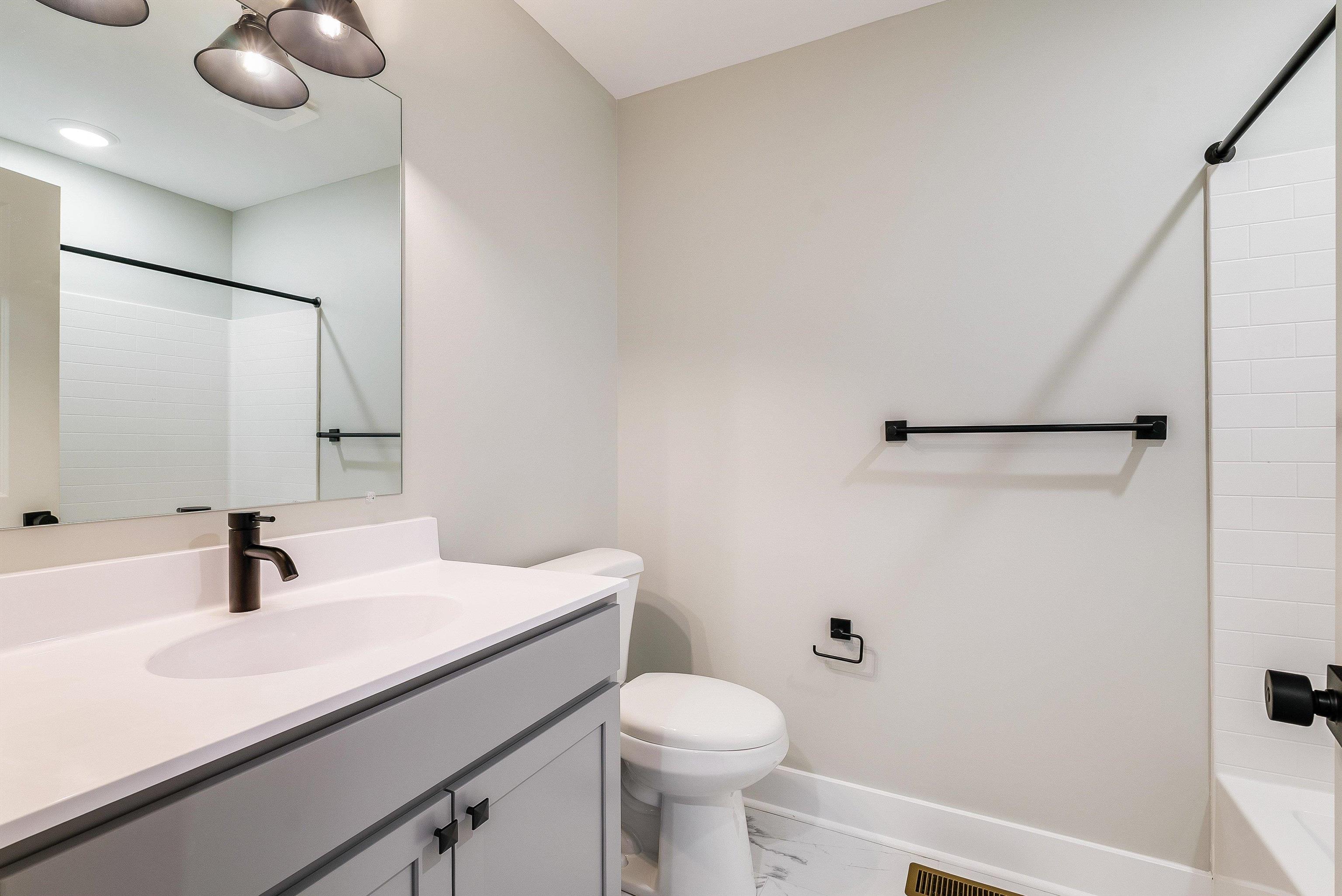 17 Barnyard Circle Bridgewater, VA 22812 - Photo 38 of 74 a bathroom with a sink a toilet and a mirror