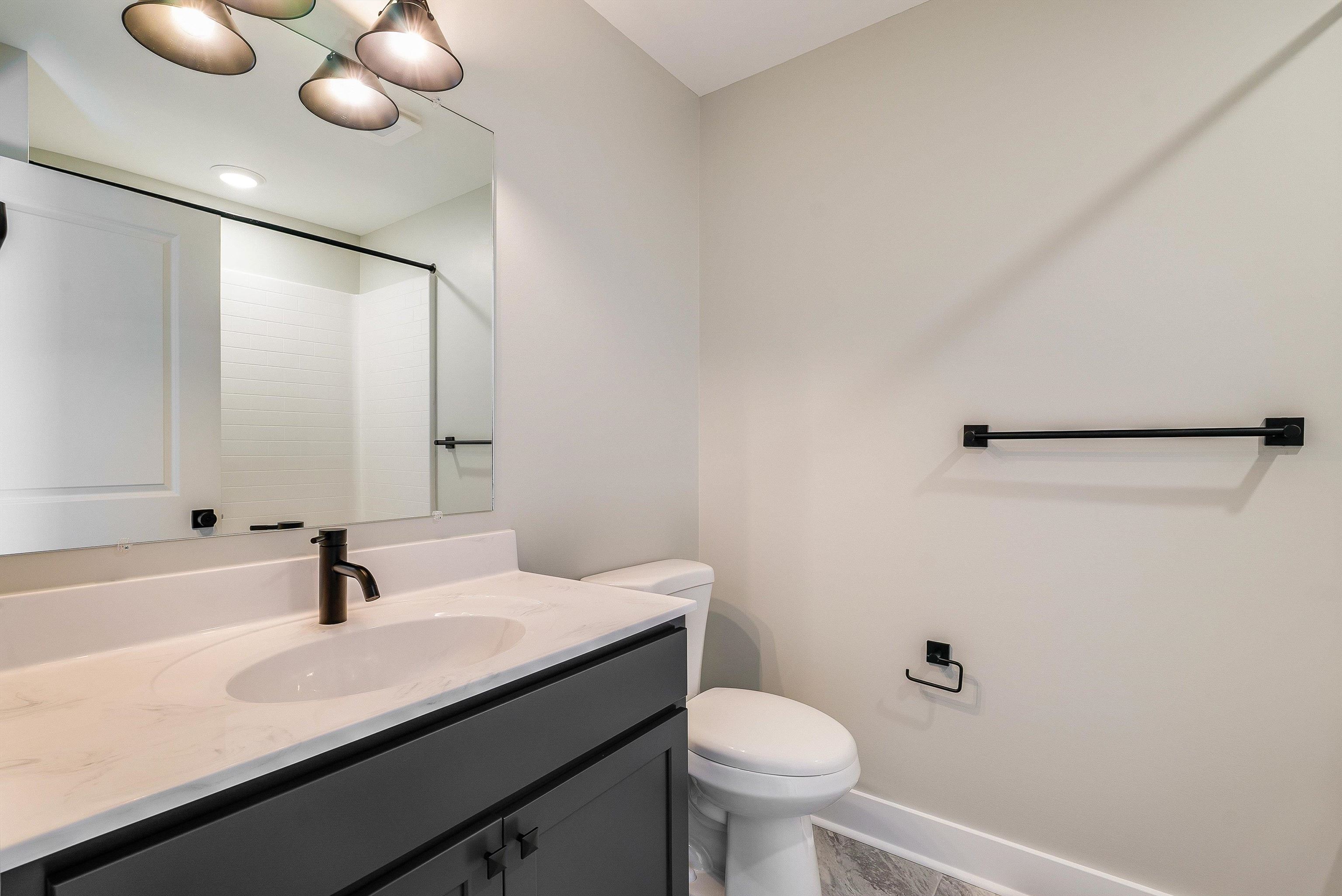17 Barnyard Circle Bridgewater, VA 22812 - Photo 39 of 74 a bathroom with a sink a toilet and a mirror