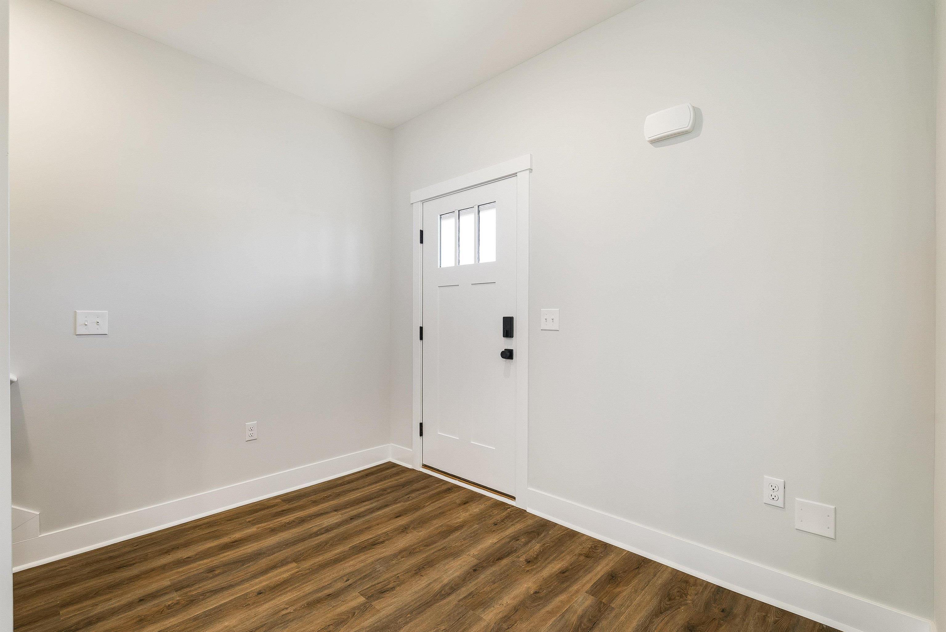 17 Barnyard Circle Bridgewater, VA 22812 - Photo 47 of 74 a view of an empty room with wooden floor and a window