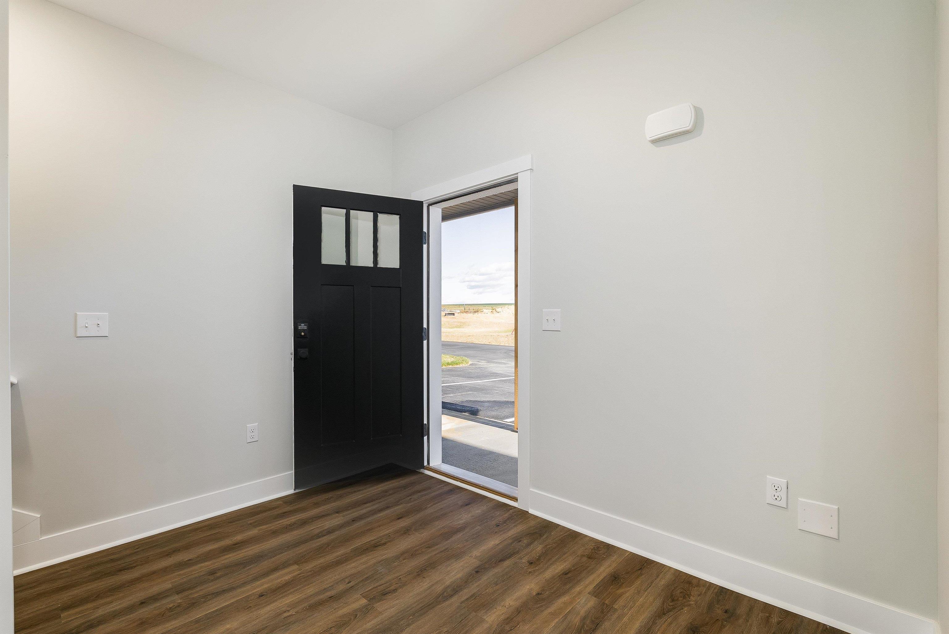 17 Barnyard Circle Bridgewater, VA 22812 - Photo 48 of 74 a view of an empty room with wooden floor and a window