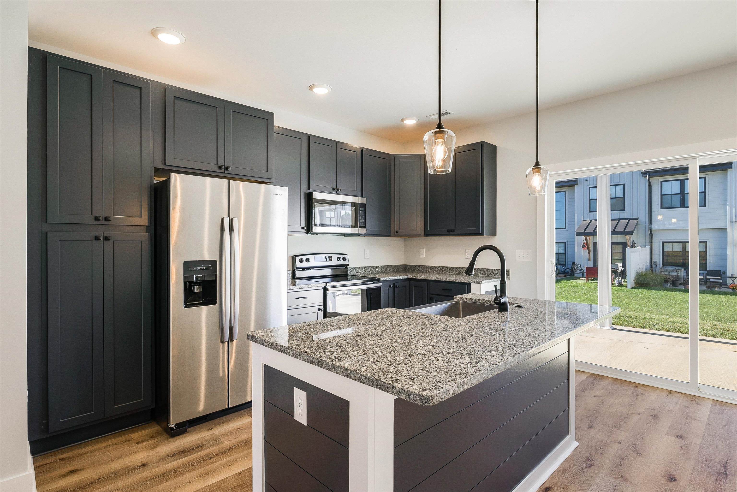 17 Barnyard Circle Bridgewater, VA 22812 - Photo 69 of 74 a kitchen with kitchen island granite countertop stainless steel appliances a refrigerator a sink a stove cabinets and wooden floor