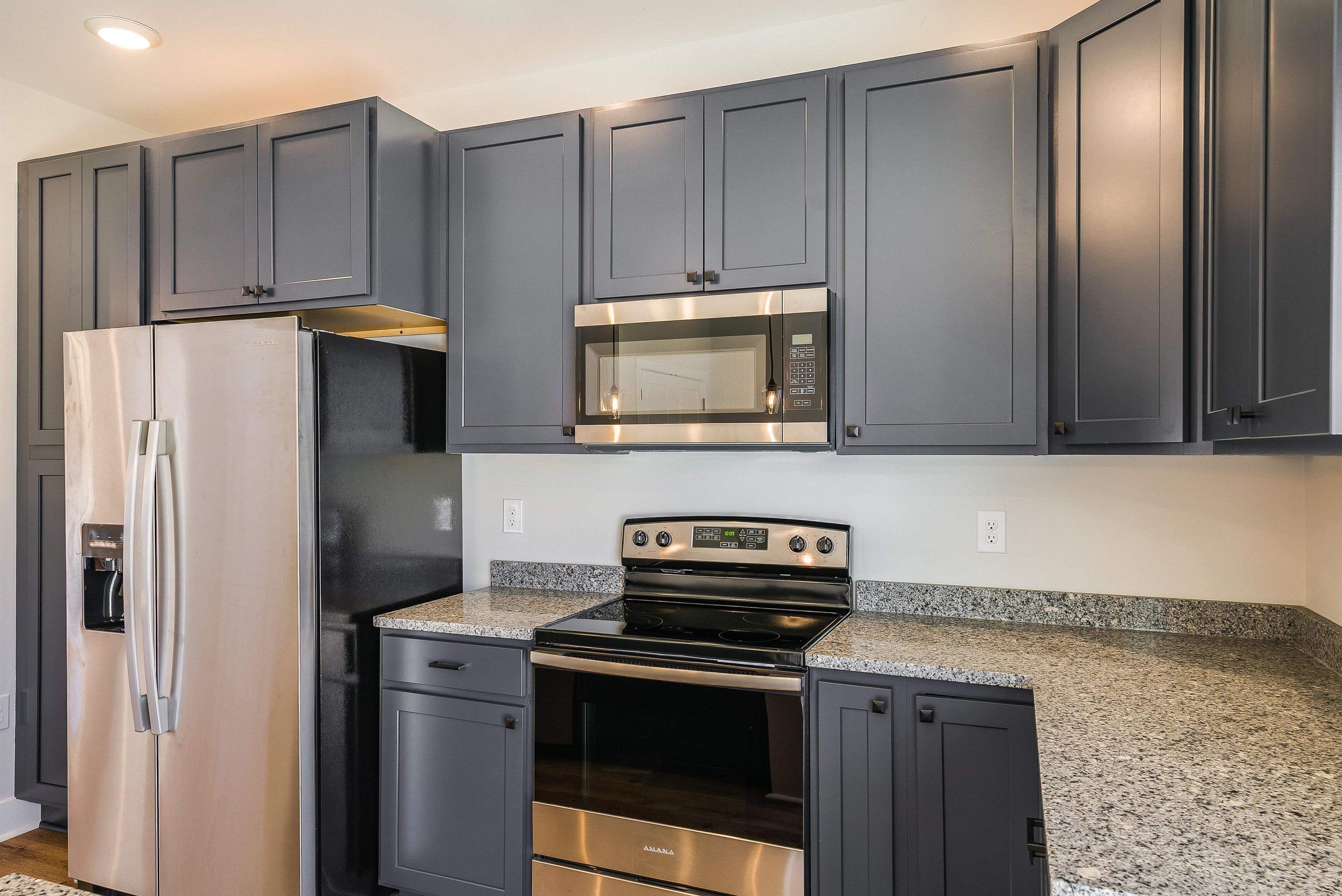 17 Barnyard Circle Bridgewater, VA 22812 - Photo 70 of 74 a kitchen with stainless steel appliances granite countertop a refrigerator stove and microwave
