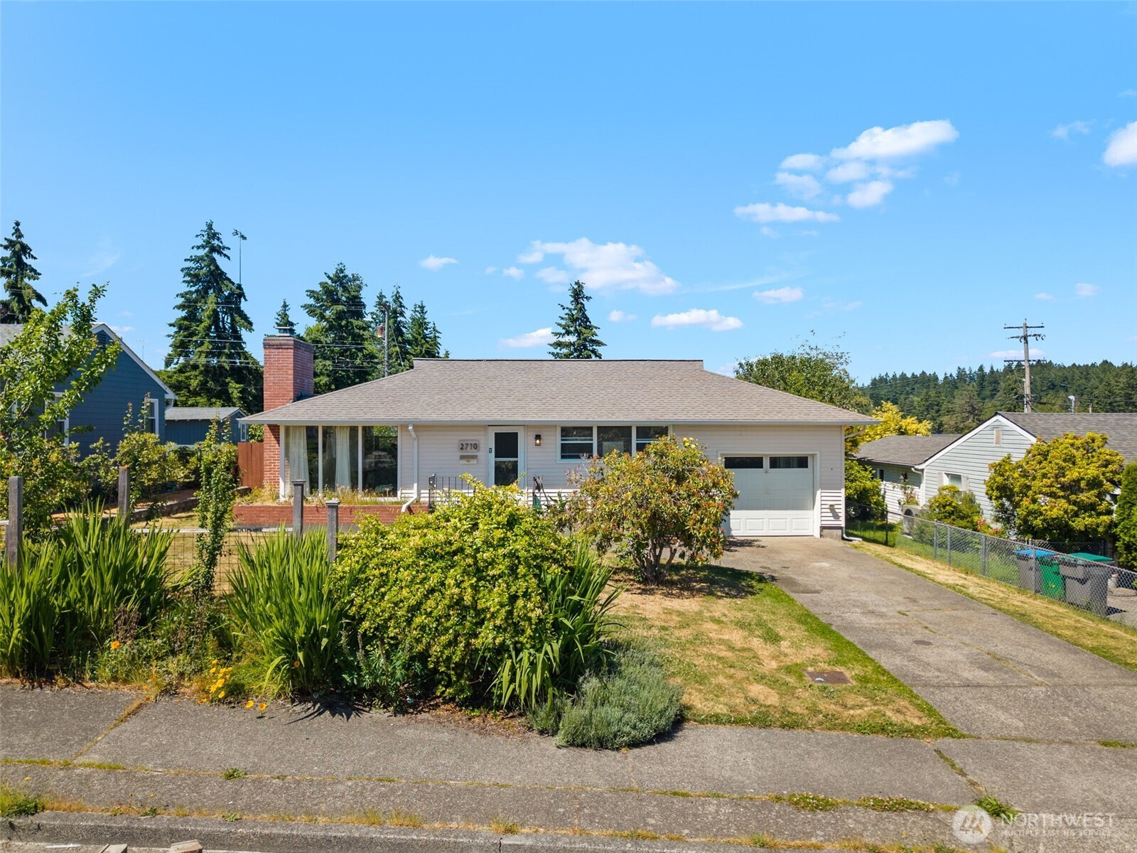 2710 Holman Street Bremerton, WA 98310 - Photo 1 of 25 a front view of a house with a yard
