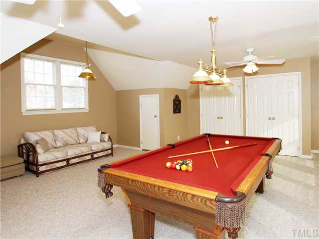 405 Normandy Road Louisburg, NC 27549 - Photo 13 of 22 The bonus room can also be a 4th bedroom. It has TONS of windows and a HUGE closet.