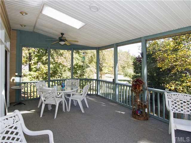 405 Normandy Road Louisburg, NC 27549 - Photo 17 of 22 Sweet tea in summer or hot cocoa in winter - you can't go wrong with a huge screened in porch.