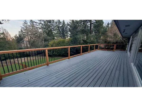 a view of balcony with wooden floor