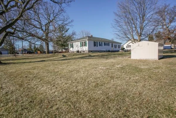 a view of a house with a yard