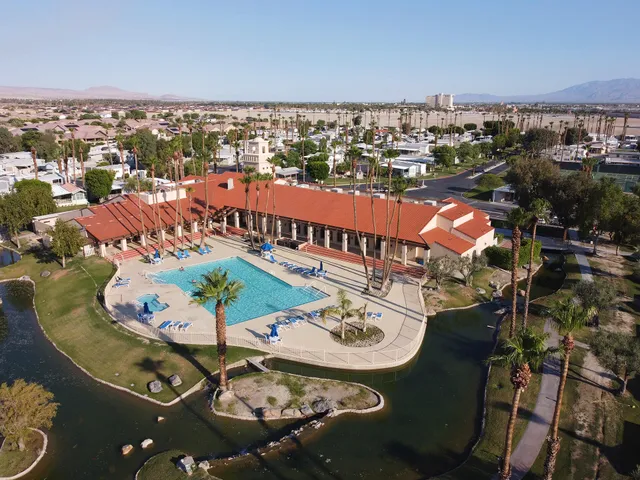 an aerial view of a balcony with chairs