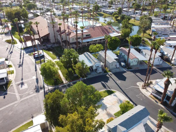 an aerial view of residential houses with outdoor space