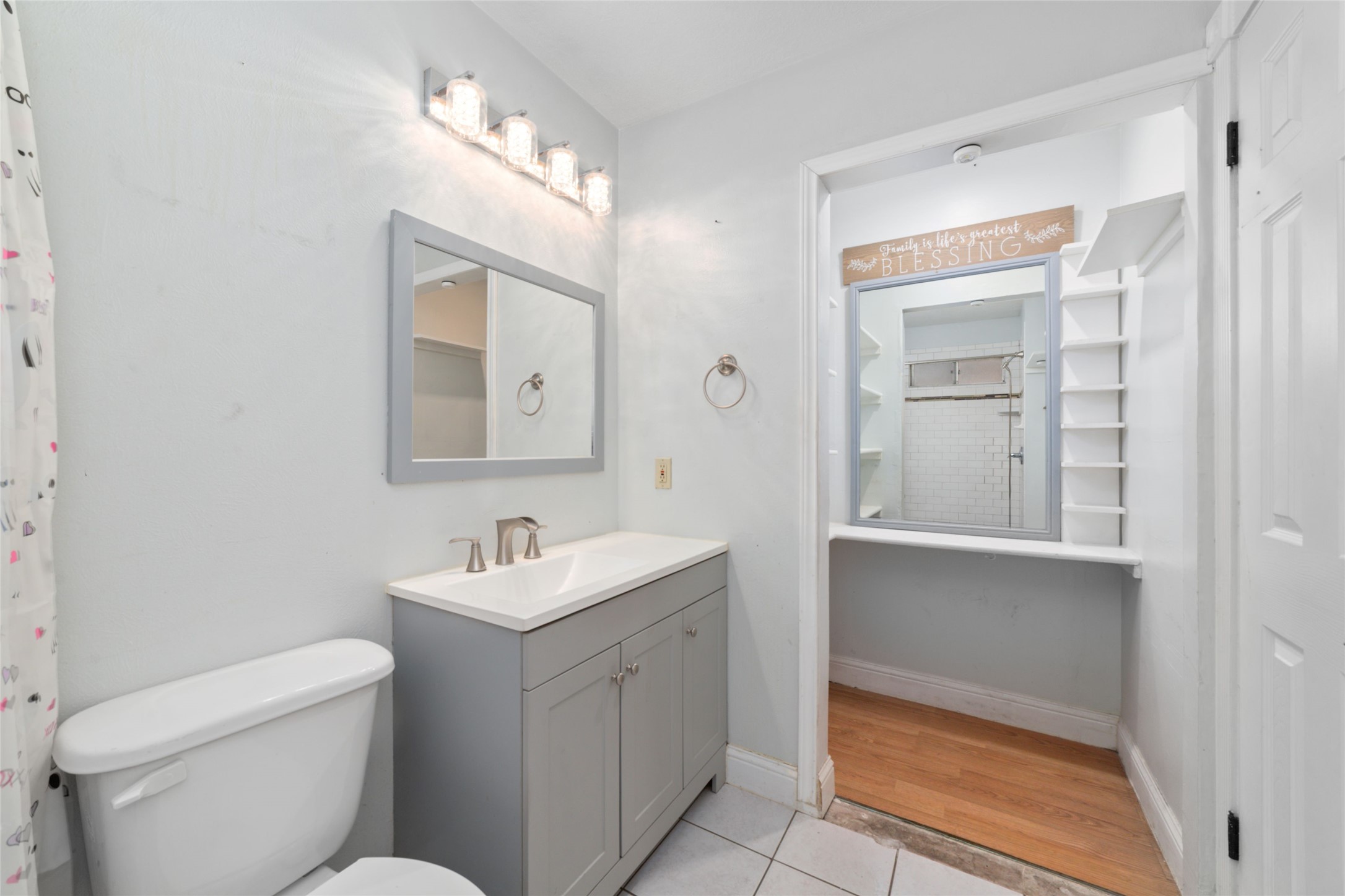 2318 Gum Spring Lane Spring, TX 77373 - Photo 17 of 25 a bathroom with a toilet sink and mirror