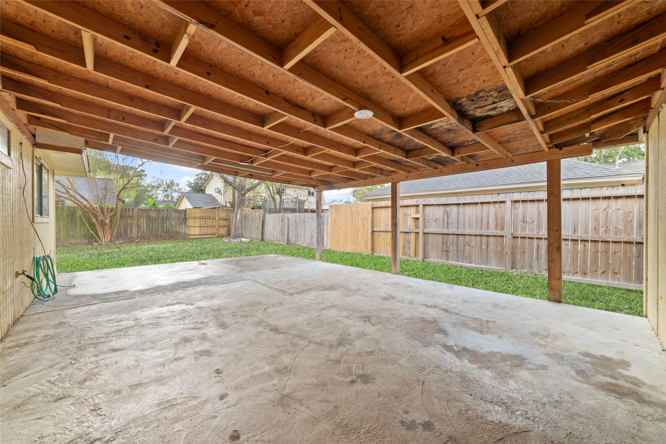 2318 Gum Spring Lane Spring, TX 77373 - Photo 23 of 25 a view of a backyard with wooden fence
