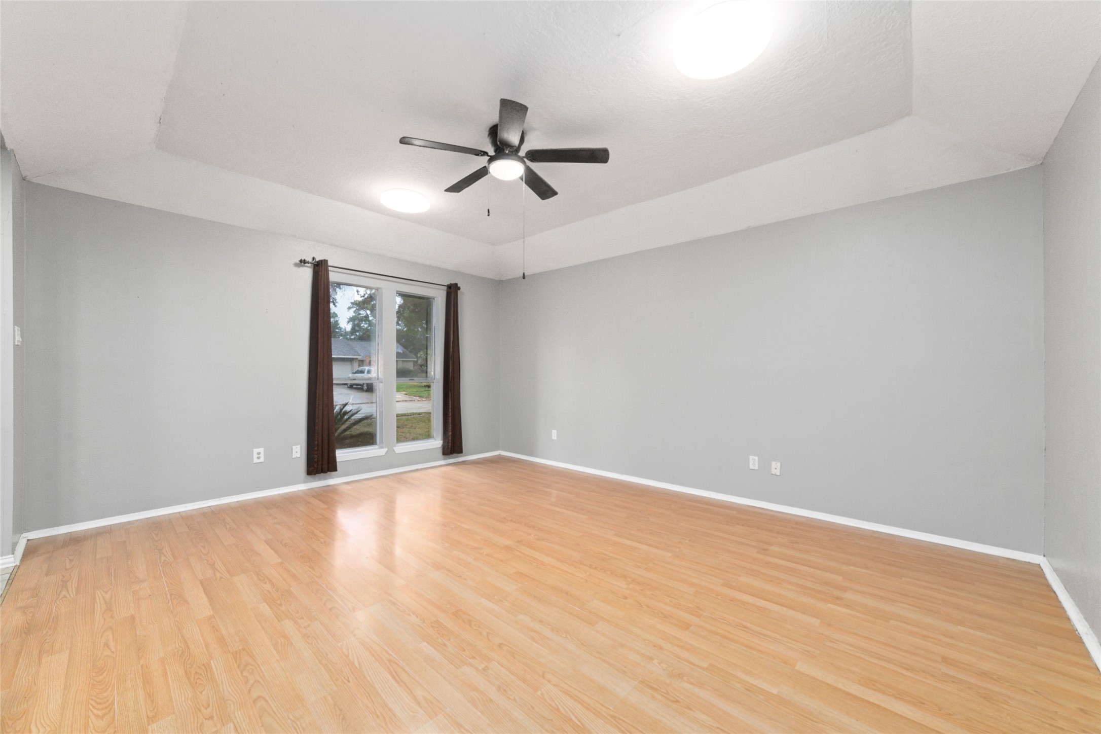 2318 Gum Spring Lane Spring, TX 77373 - Photo 5 of 25 a view of an empty room with wooden floor and a window