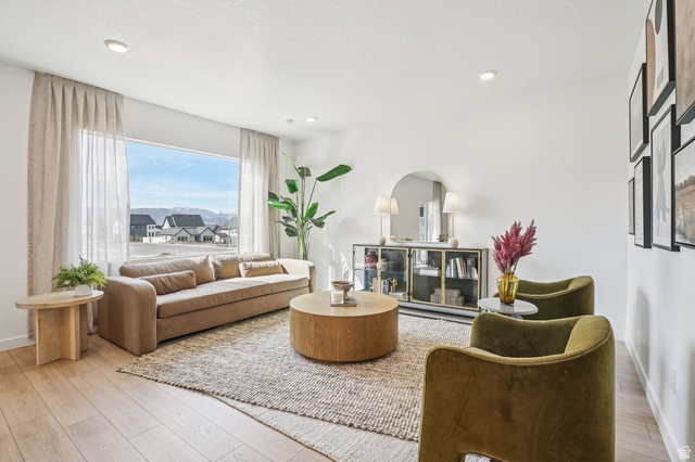 2097 North Ostler Peak Road, Unit 115 Heber City, UT 84032 - Photo 23 of 33 Spacious room featuring light wood-finish flooring, recessed lighting, and a large window with mountain scenery