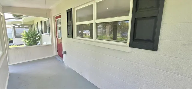 a view of empty room with windows