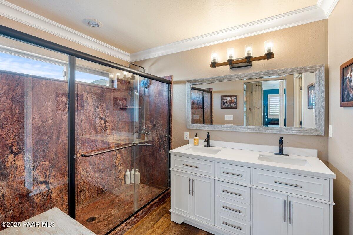 5757 East Longhorn Road Chino Valley, AZ 86323 - Photo 17 of 34 a bathroom with a double vanity sink mirror and shower