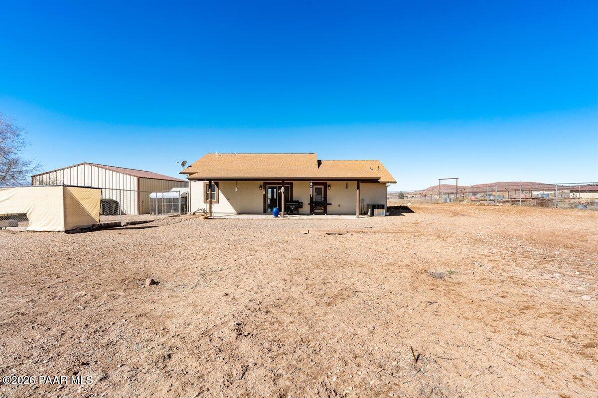 5757 East Longhorn Road Chino Valley, AZ 86323 - Photo 24 of 34 a front view of a house with a yard